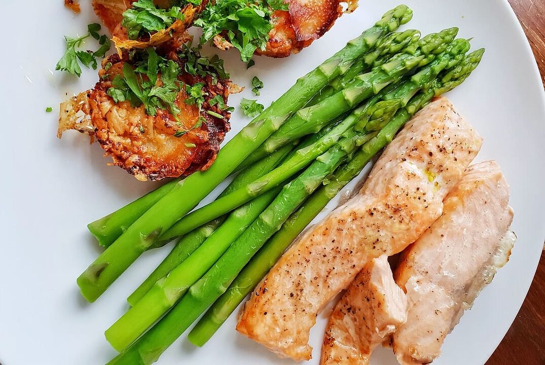 Baked fish with asparagus on a low-carb diet menu